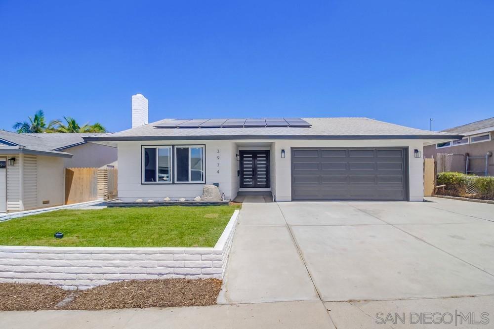 a view of front a house with a yard