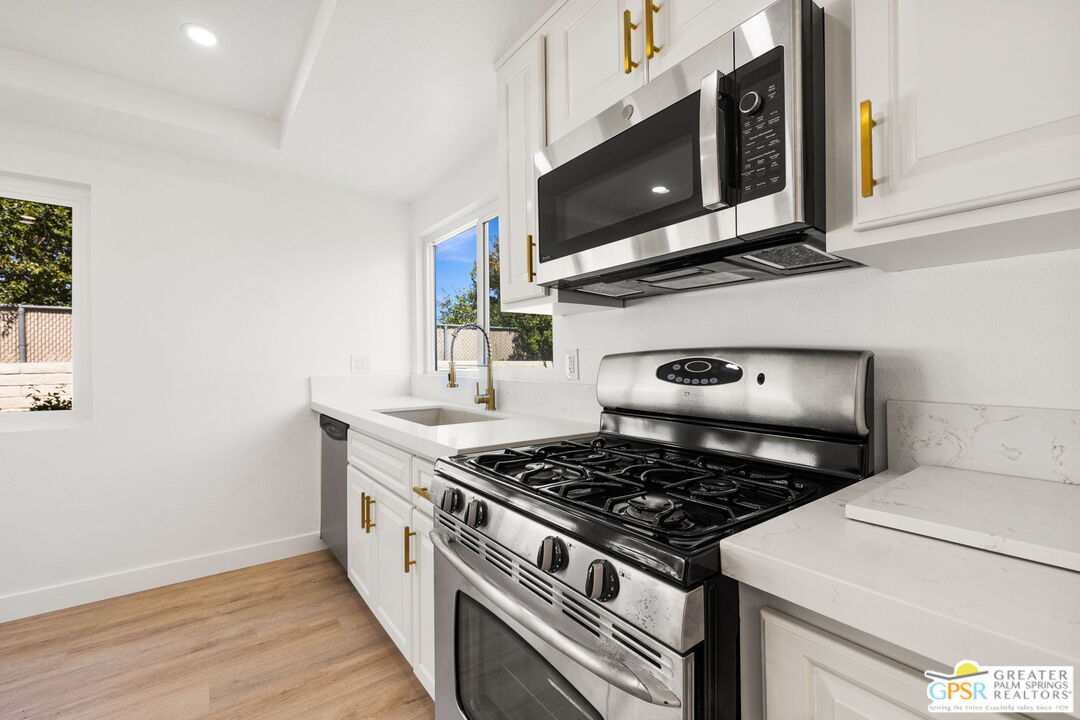 a kitchen with a stove and a microwave