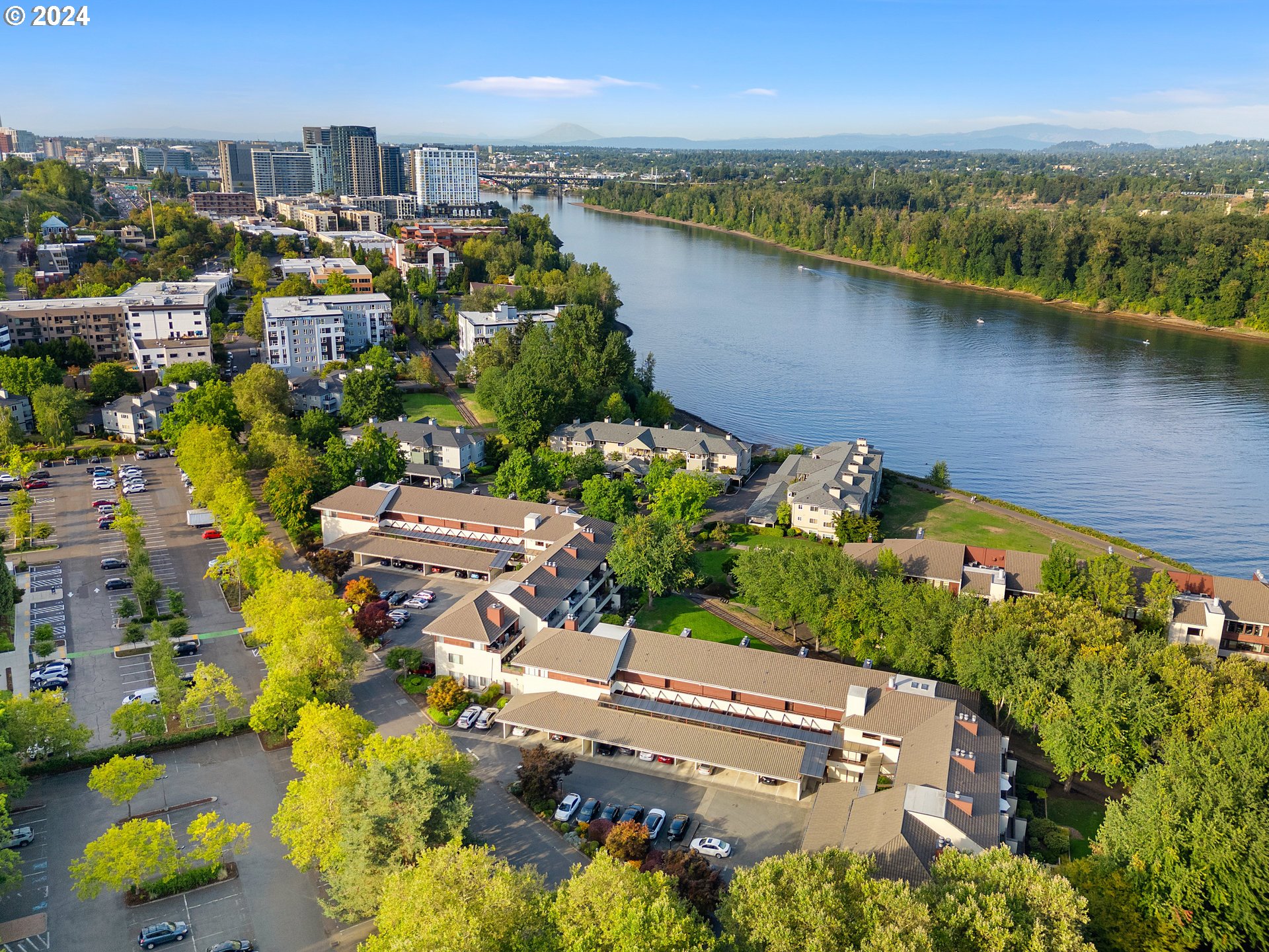 an aerial view of a house with a lake view