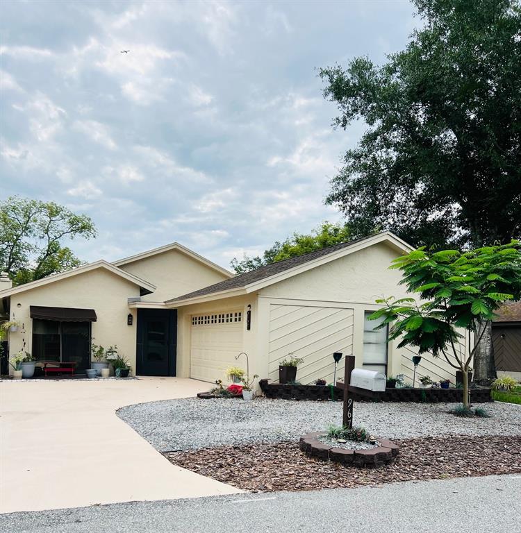 a view of a house with a yard and garage