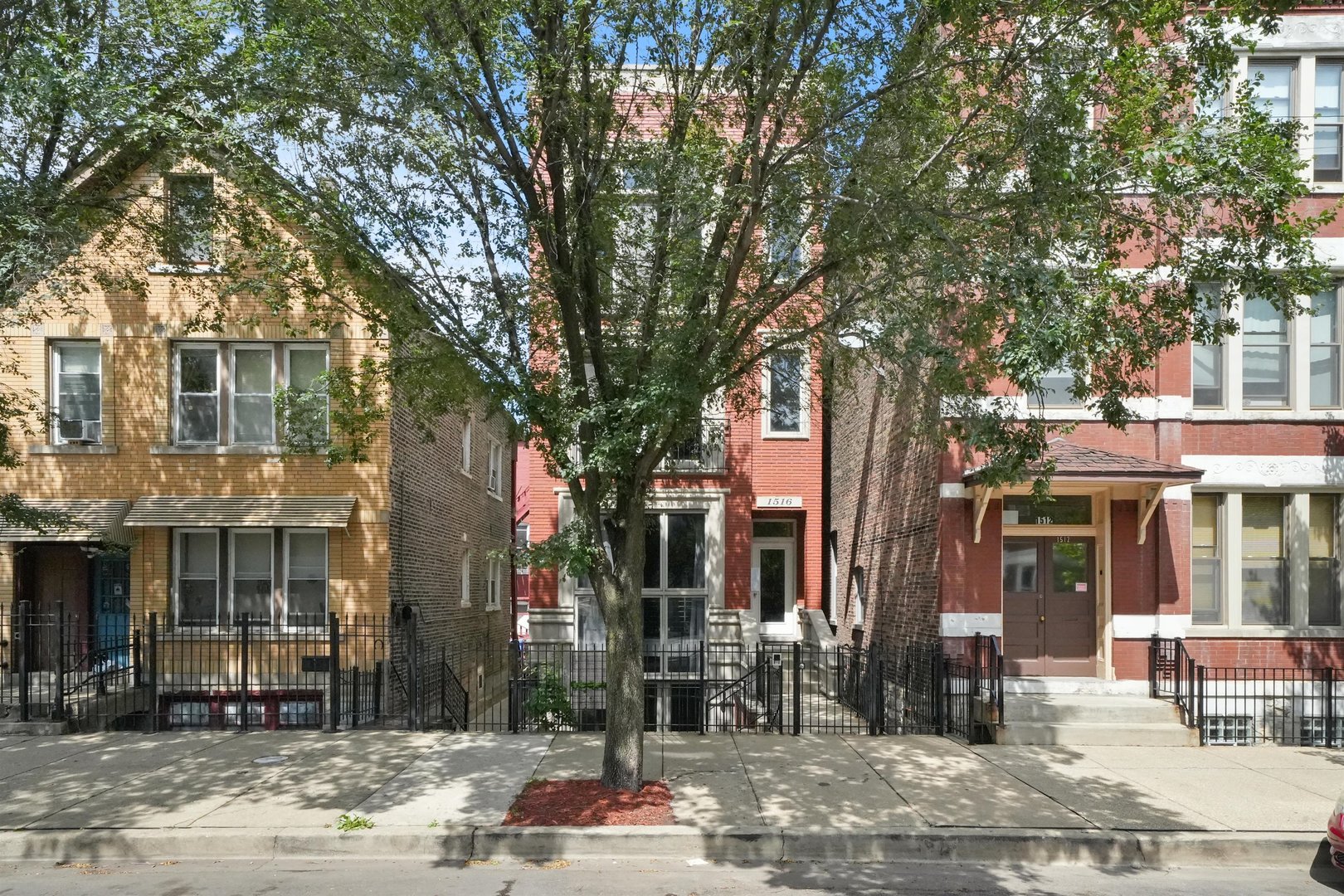 a front view of a building with street view