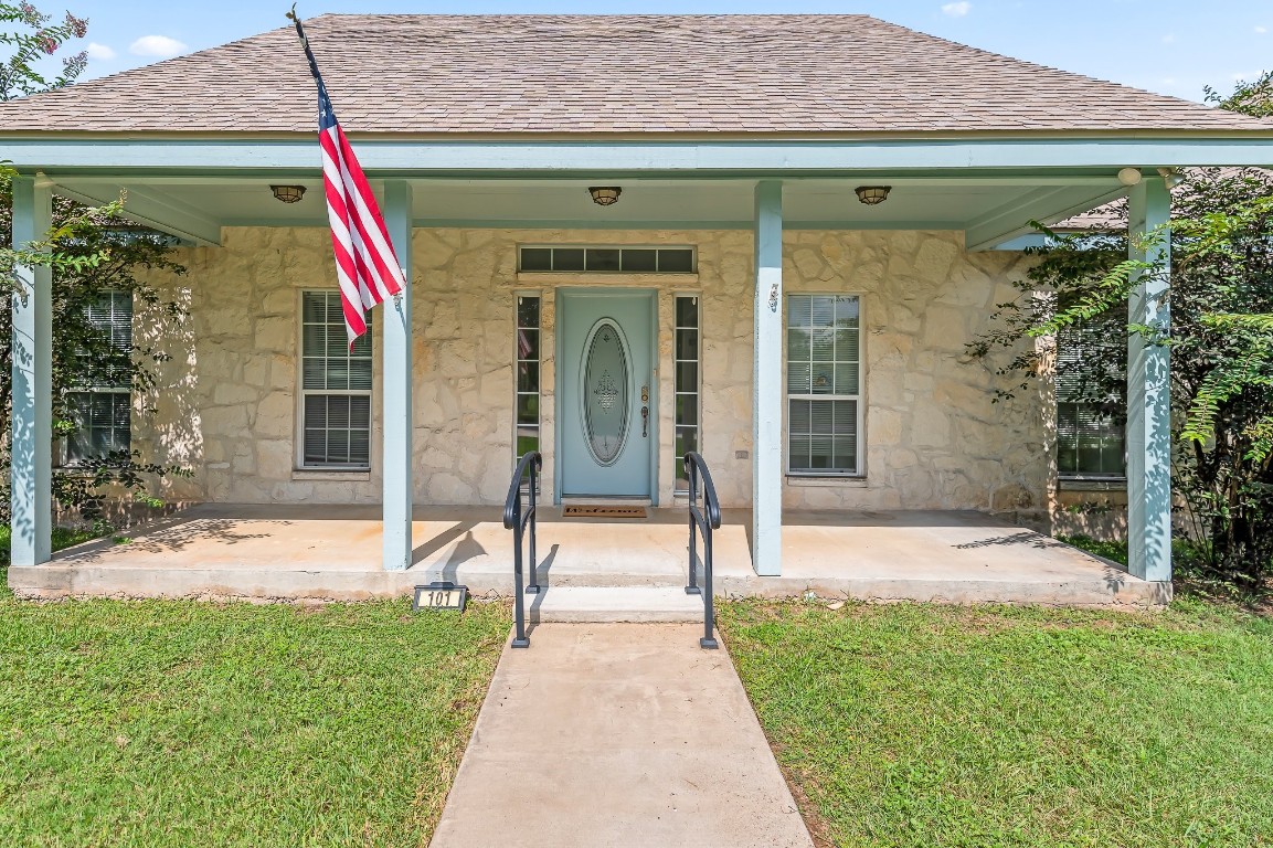 a front view of a house with a porch