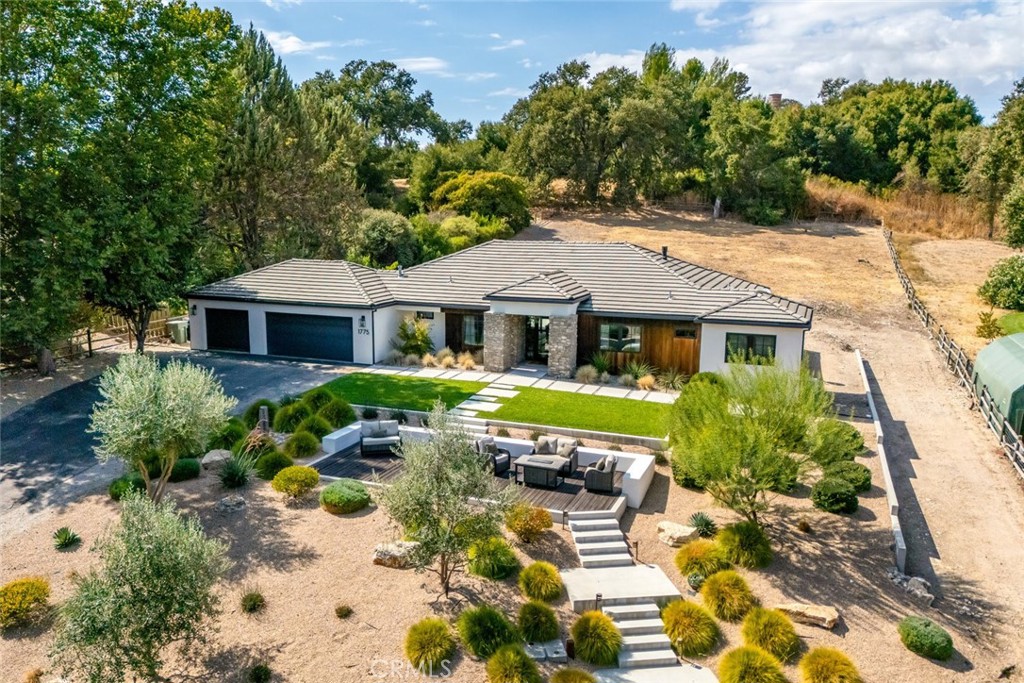 a front view of house with yard outdoor seating and green space