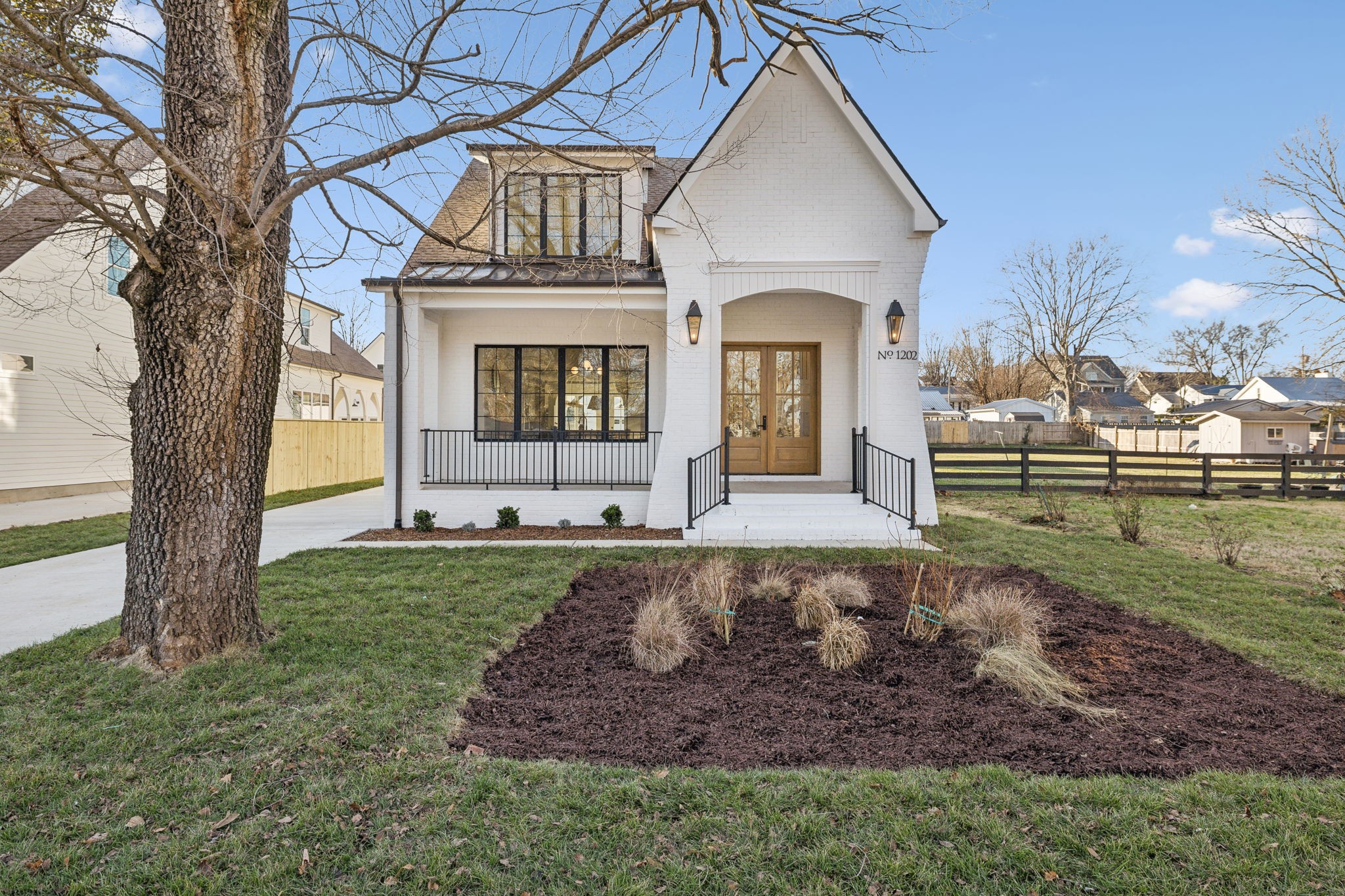 a front view of a house with a yard