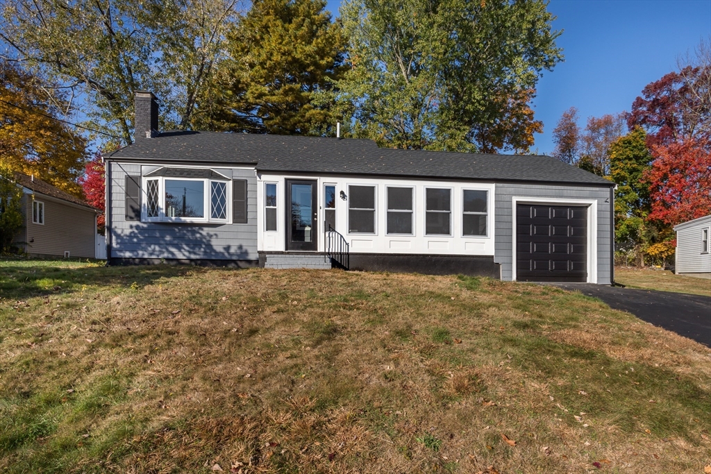 front view of a house with a yard