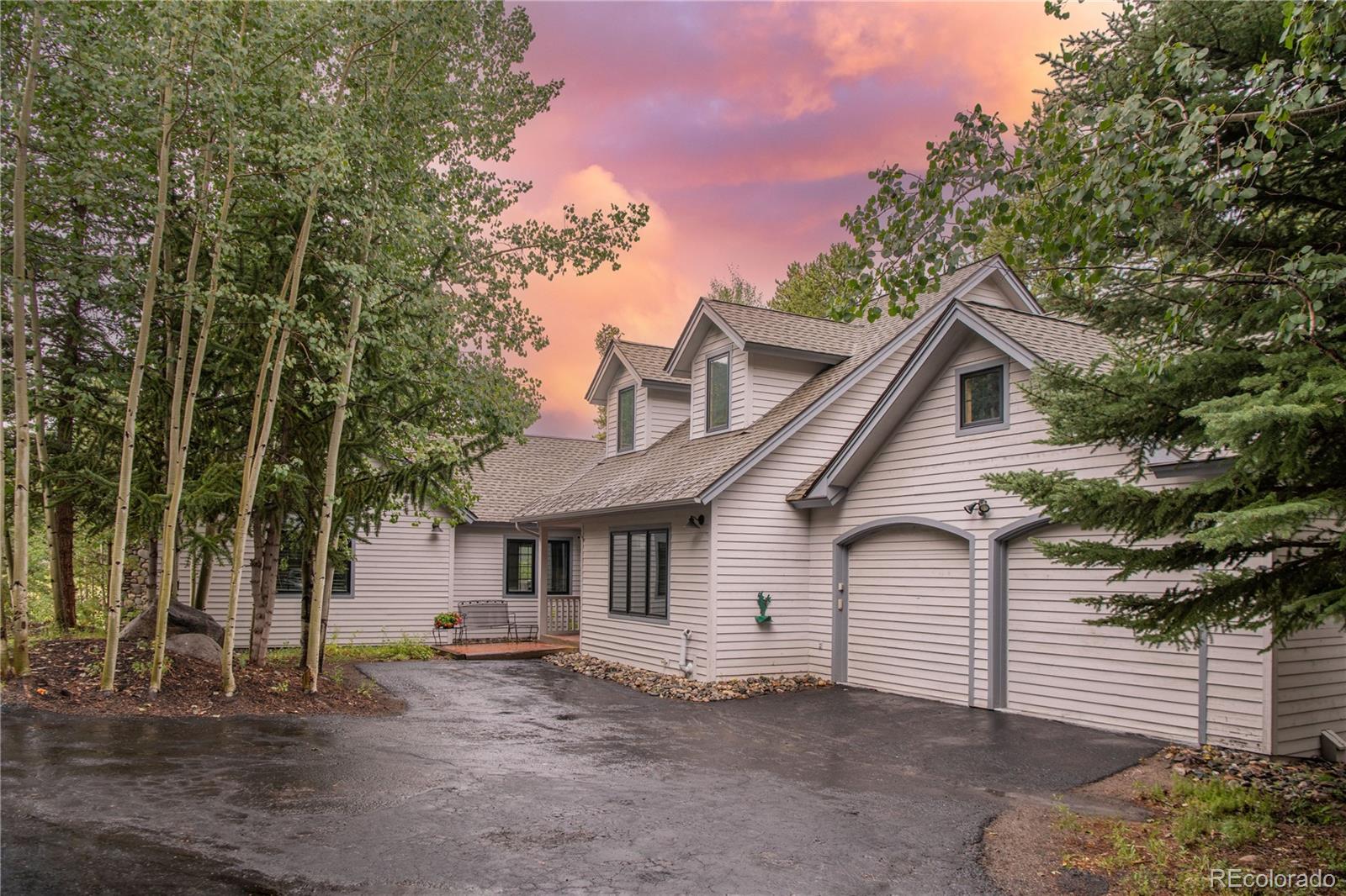 front view of a house with a trees