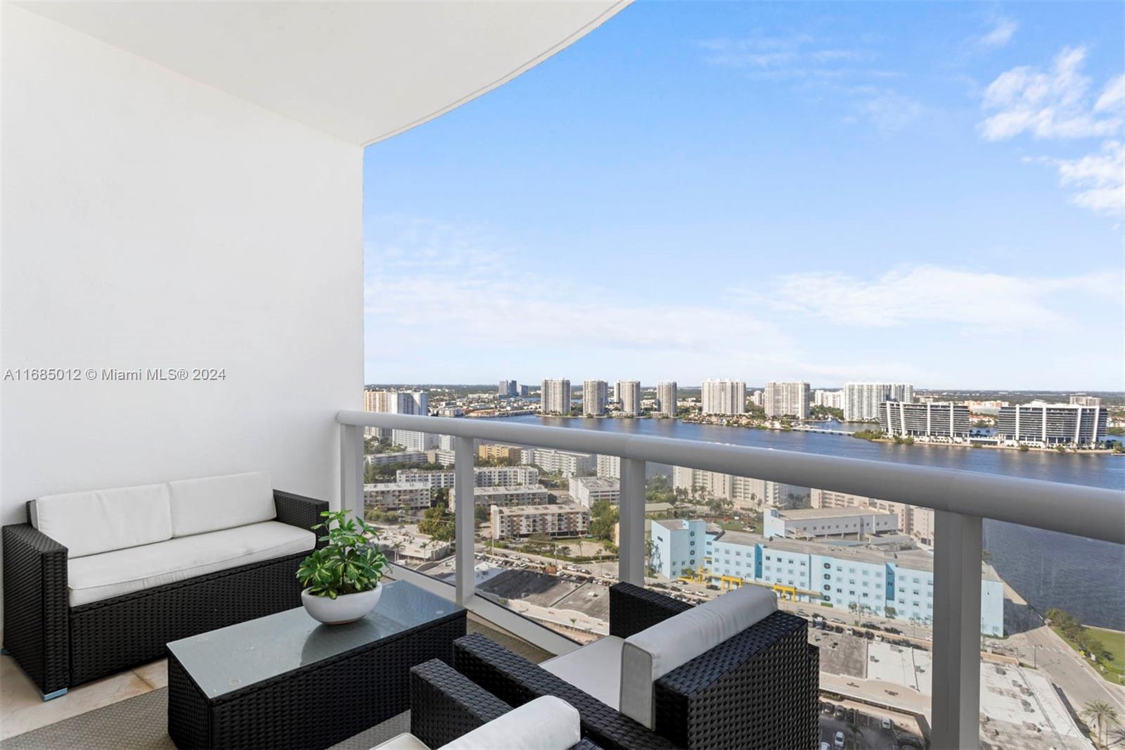 a view of a balcony with furniture