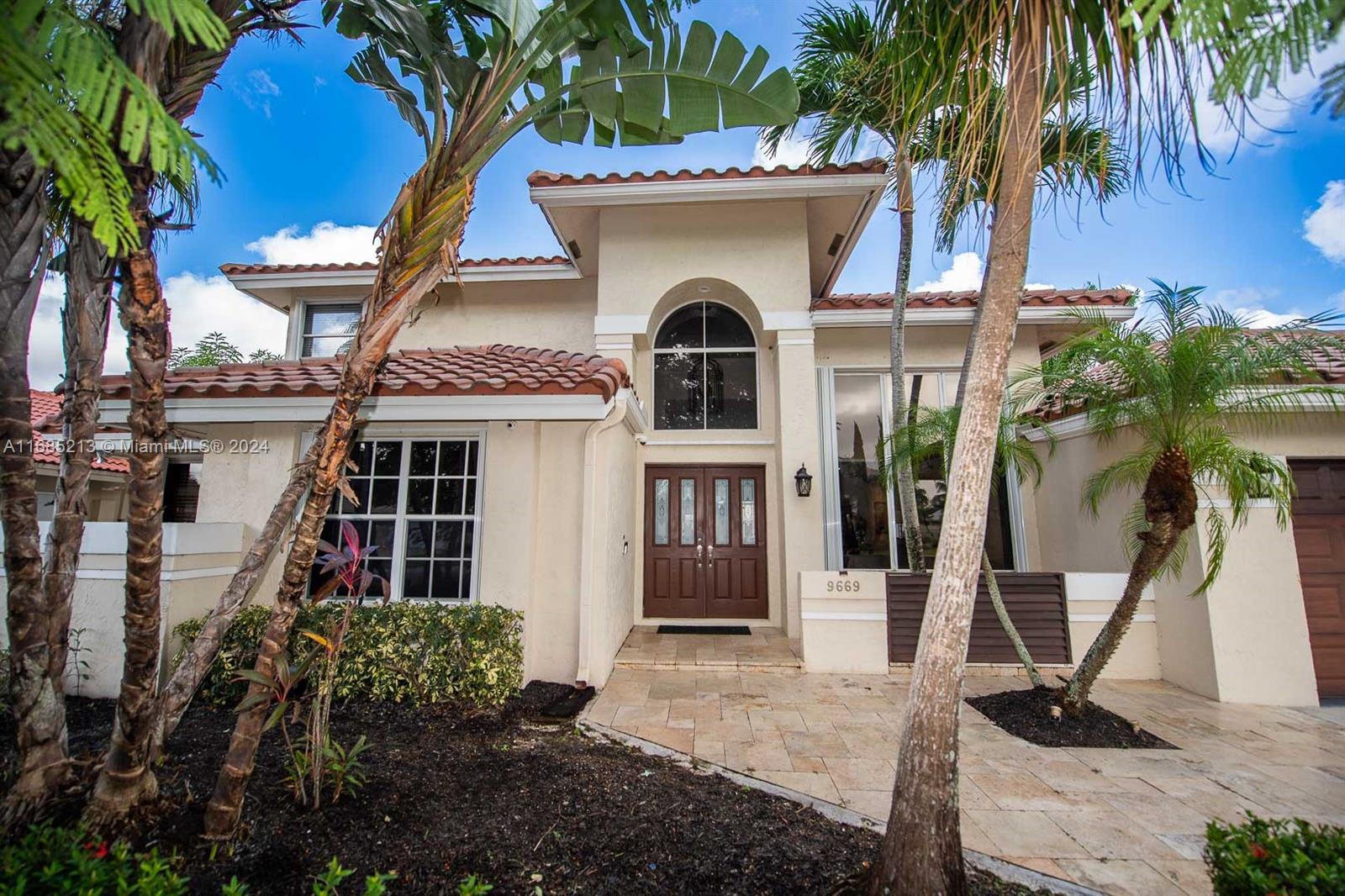 a front view of a house with yard