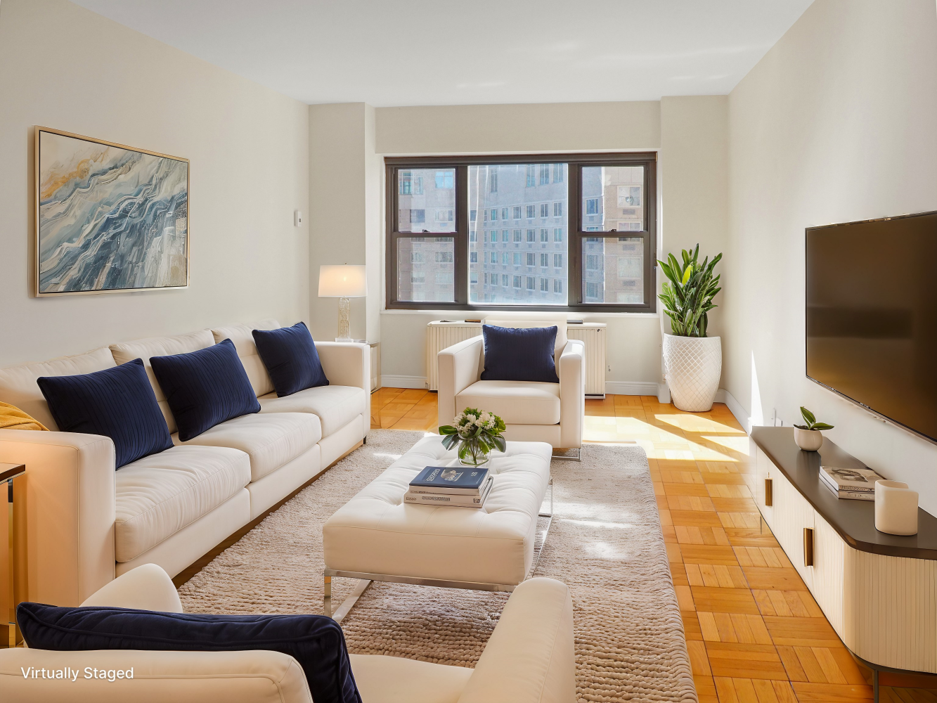 a living room with furniture and a flat screen tv