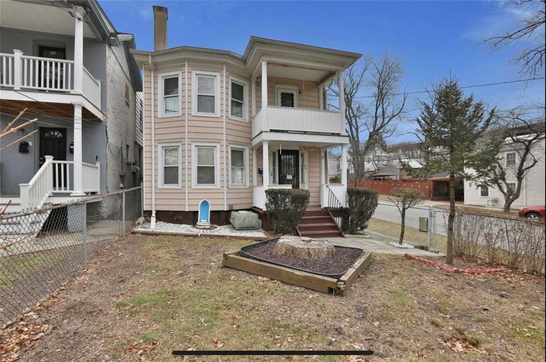 View of front of property featuring a balcony