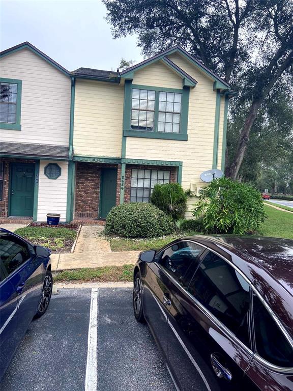 a front view of a house with parking space