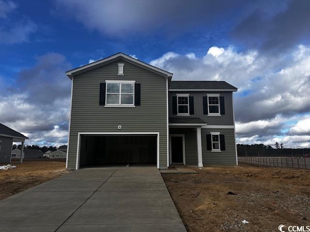 View of property featuring a garage