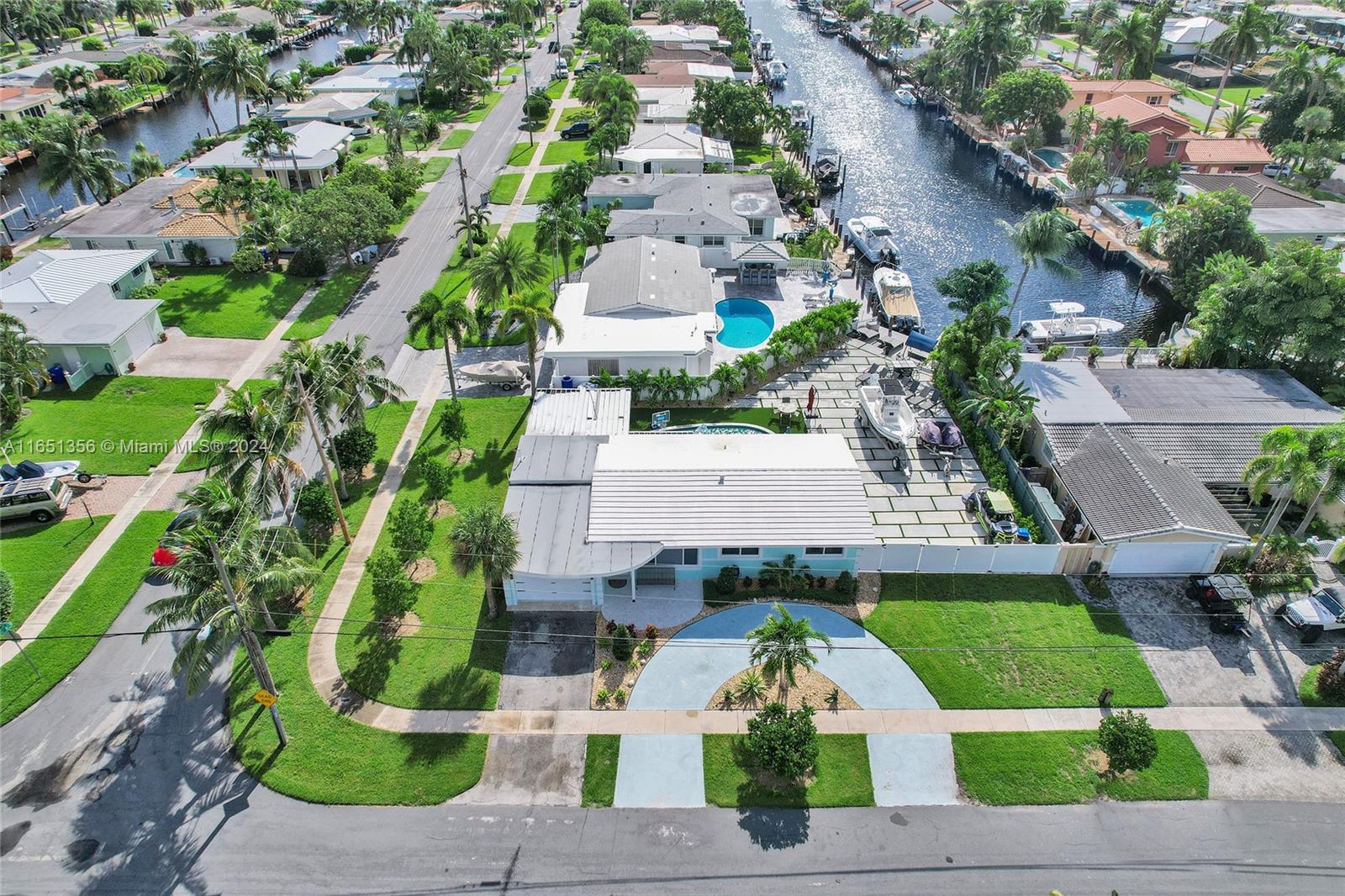 an aerial view of a house with a garden and plants