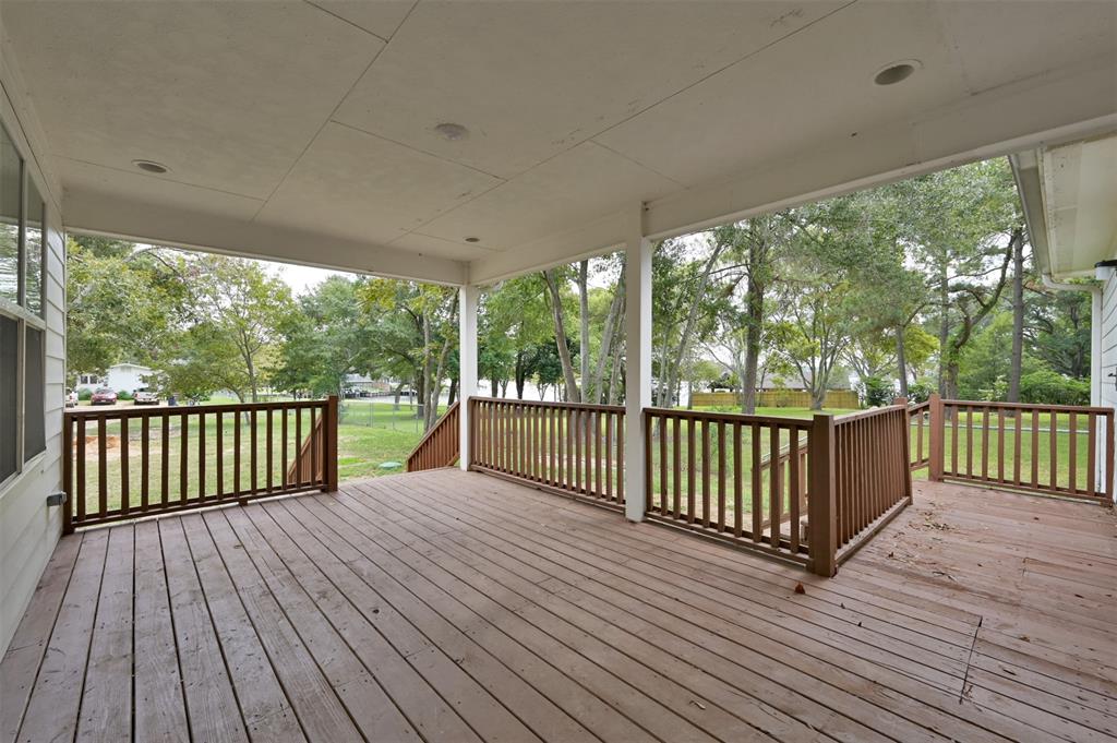 a view of balcony with wooden floor