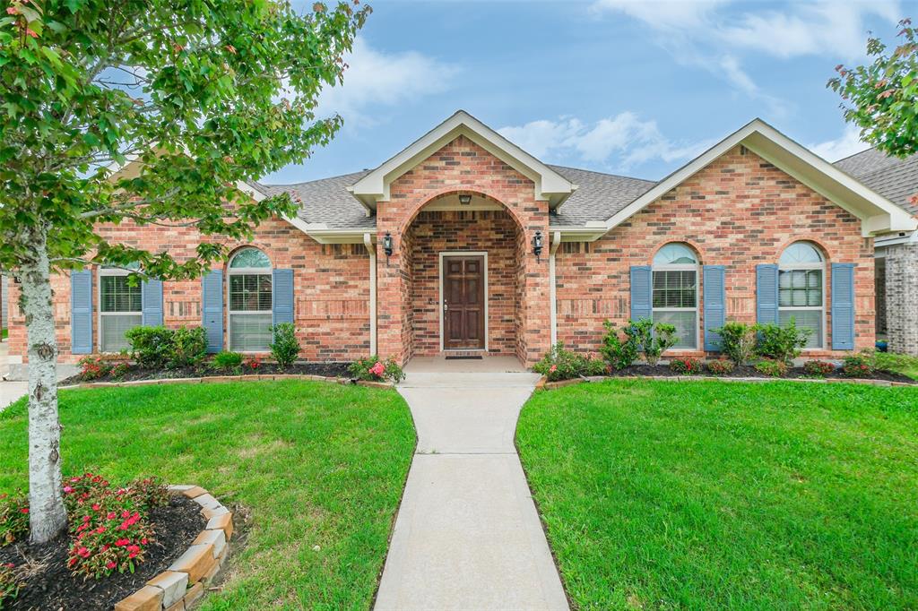 front view of a house with a yard