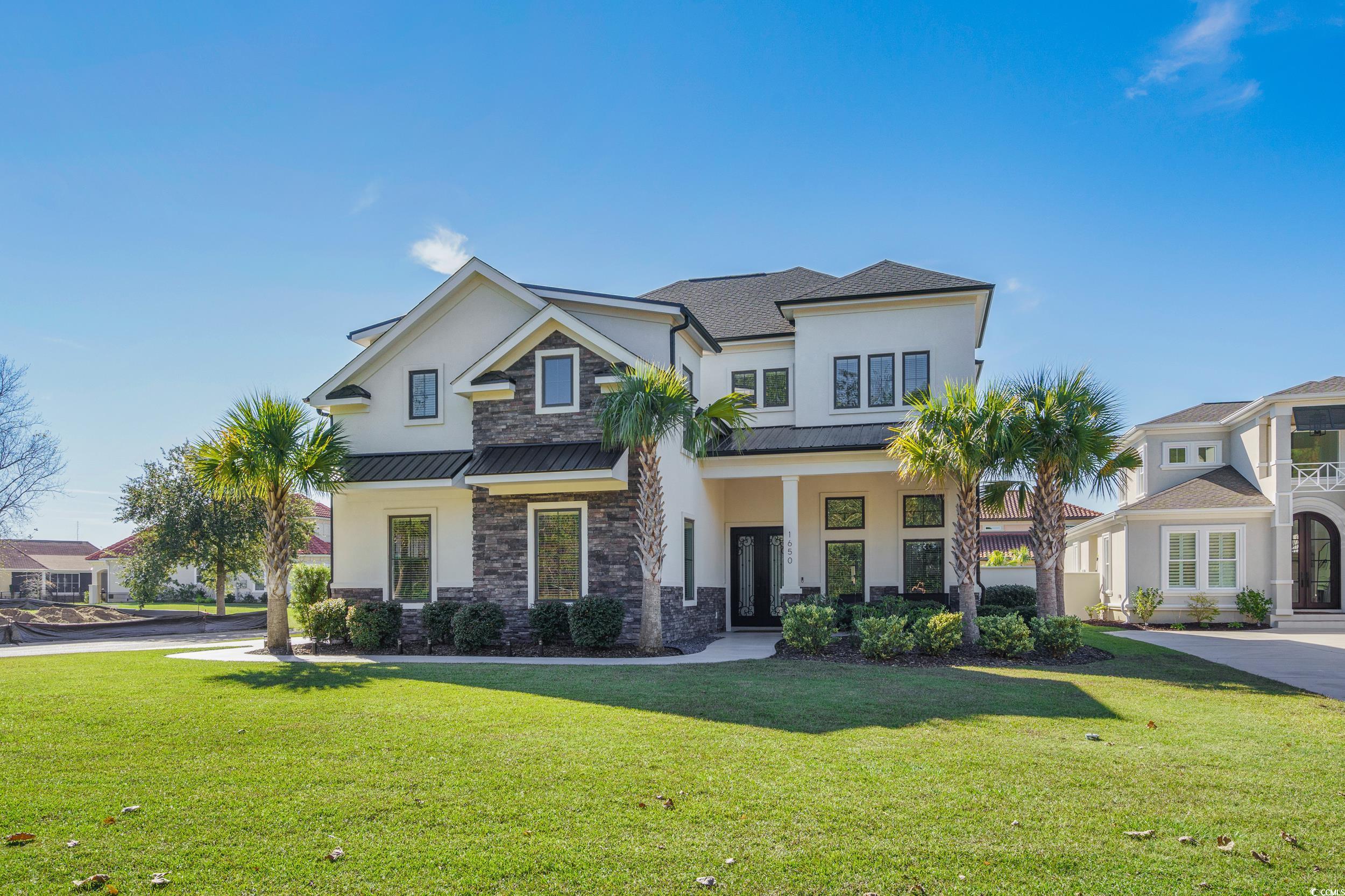 View of front of house with a front yard