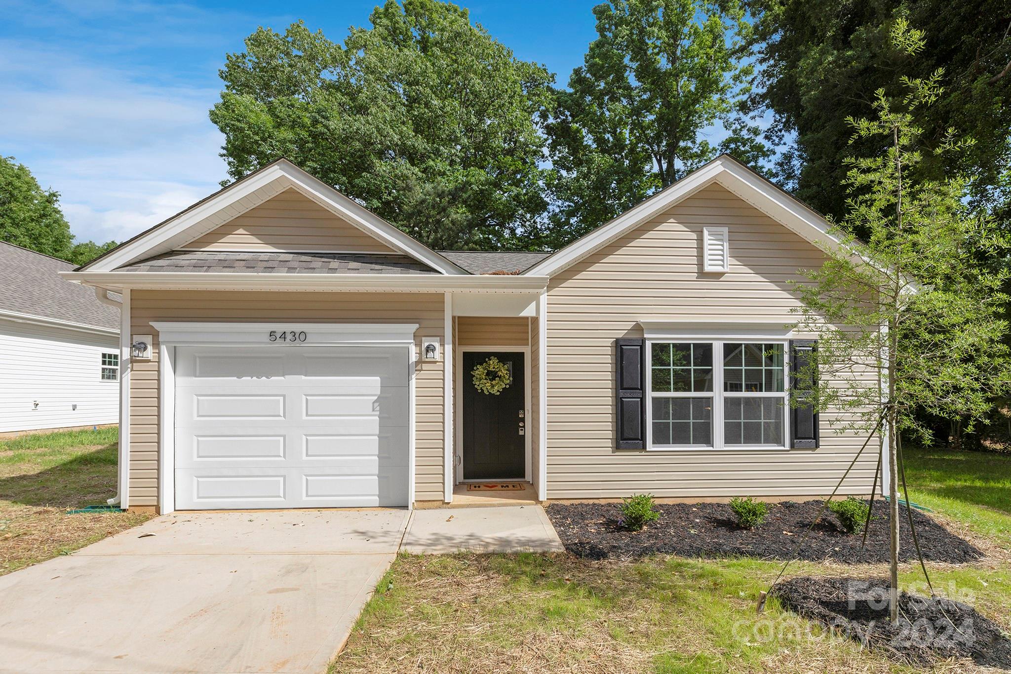 a front view of a house with garage