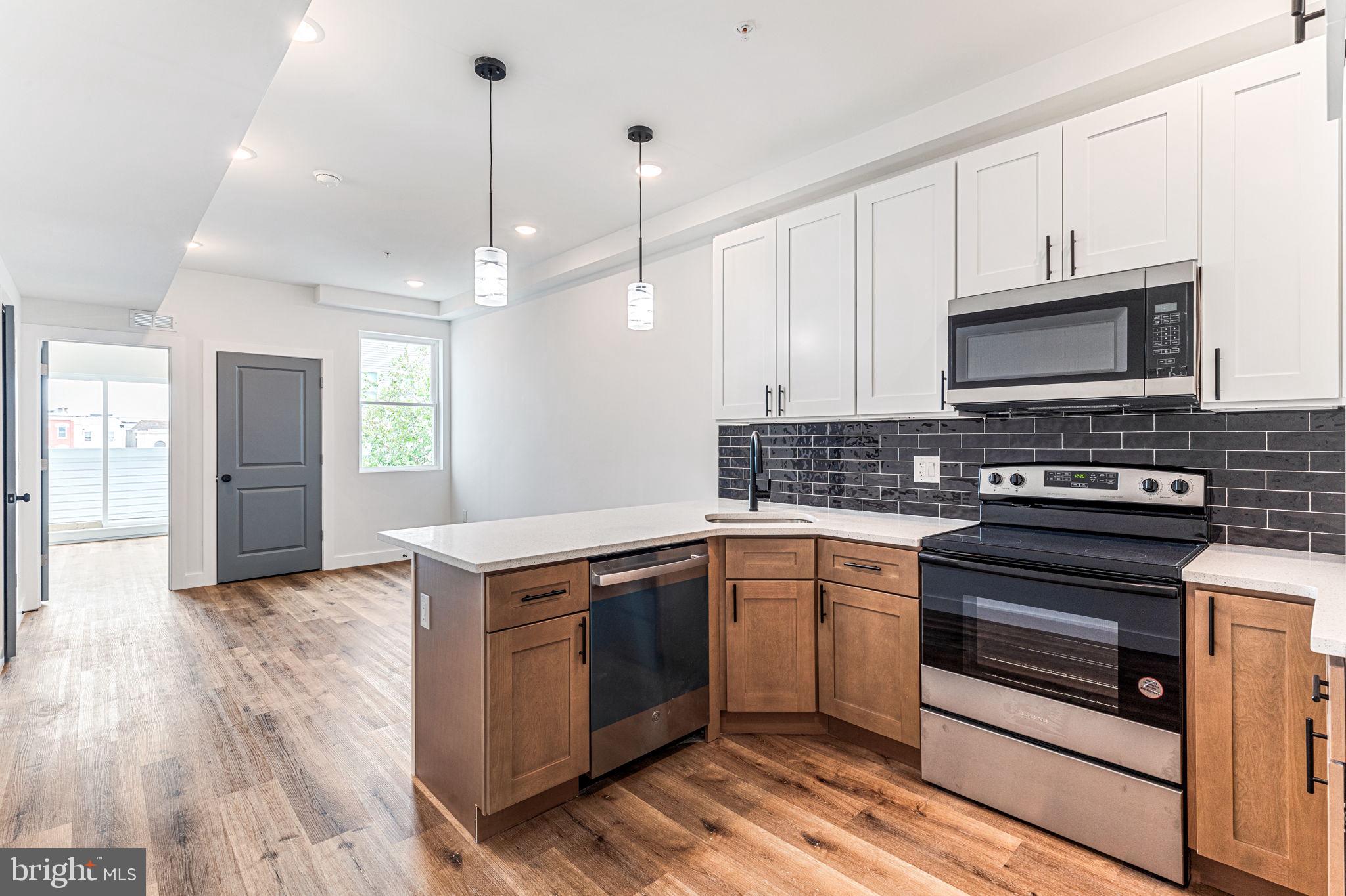 a kitchen with a stove and a microwave