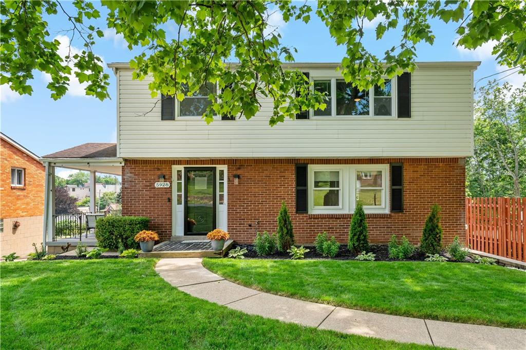 front view of a house with a yard