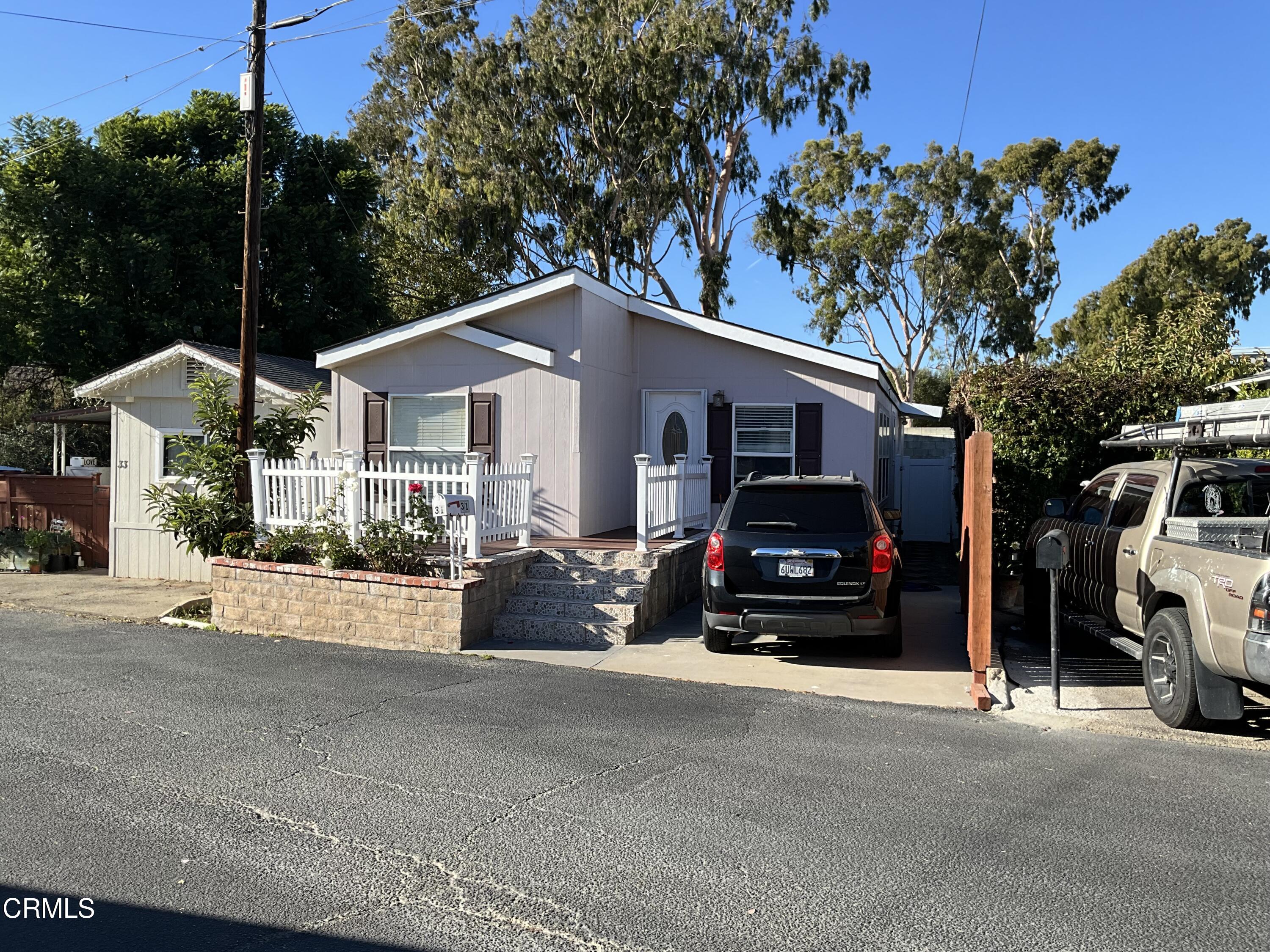 a view of a car park in front of house