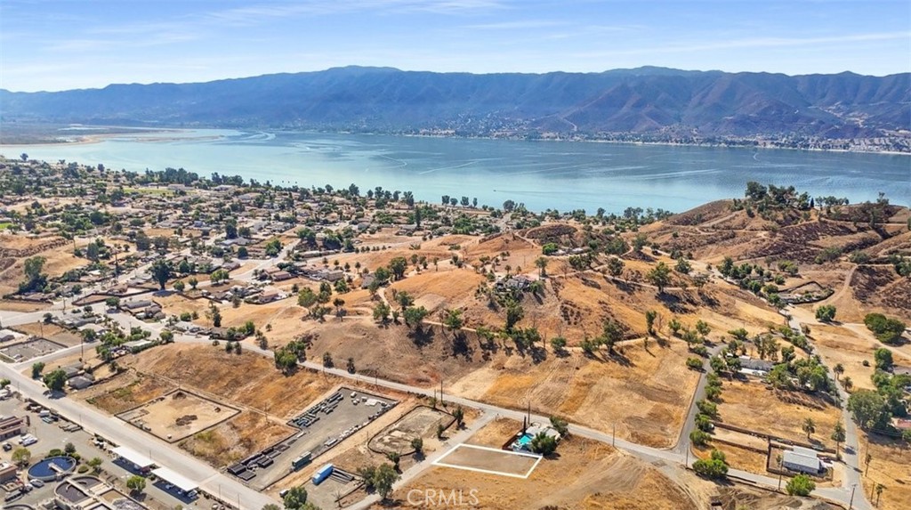 an aerial view of residential house and sandy dunes