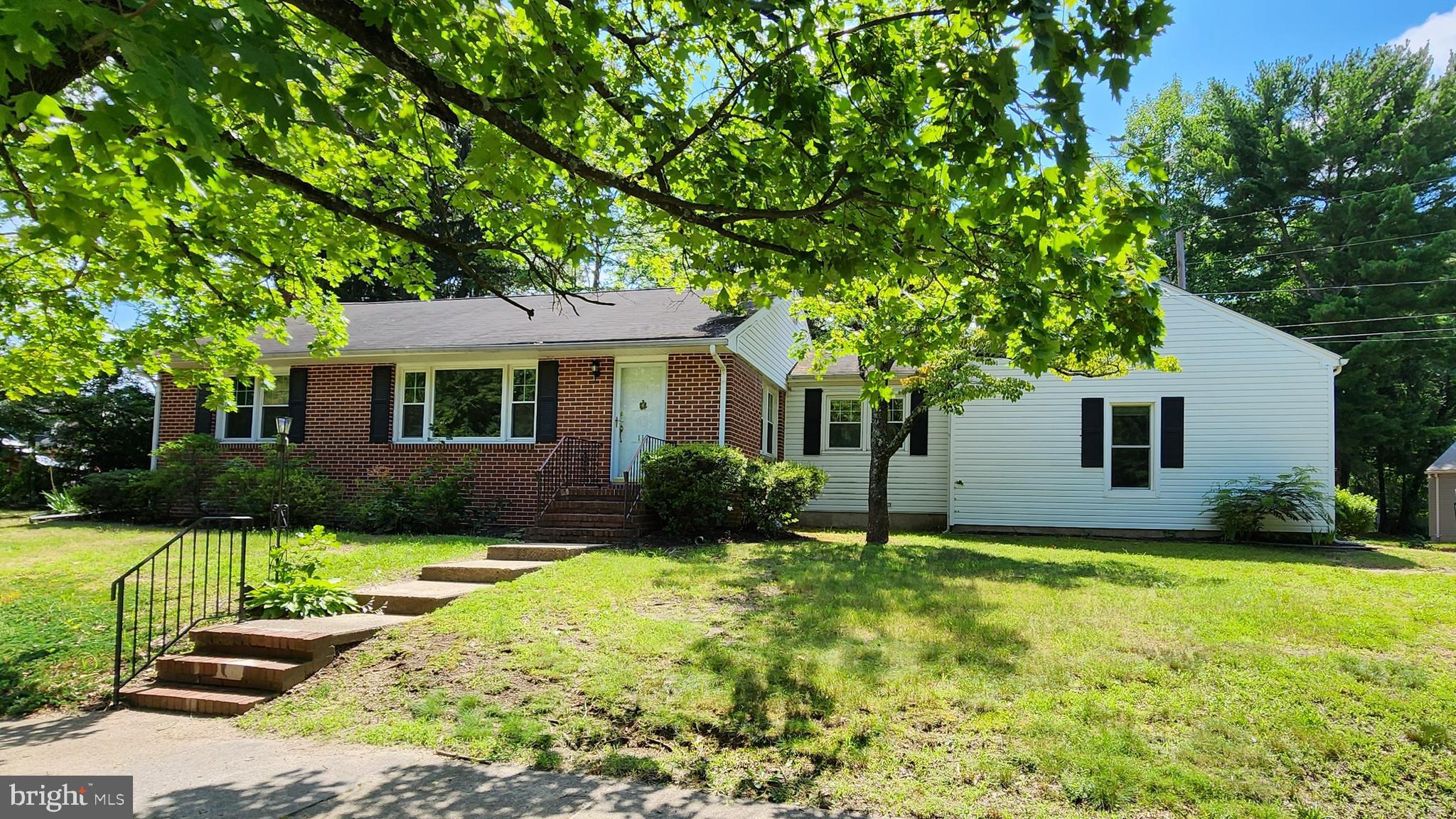 a house that has a tree in front of it