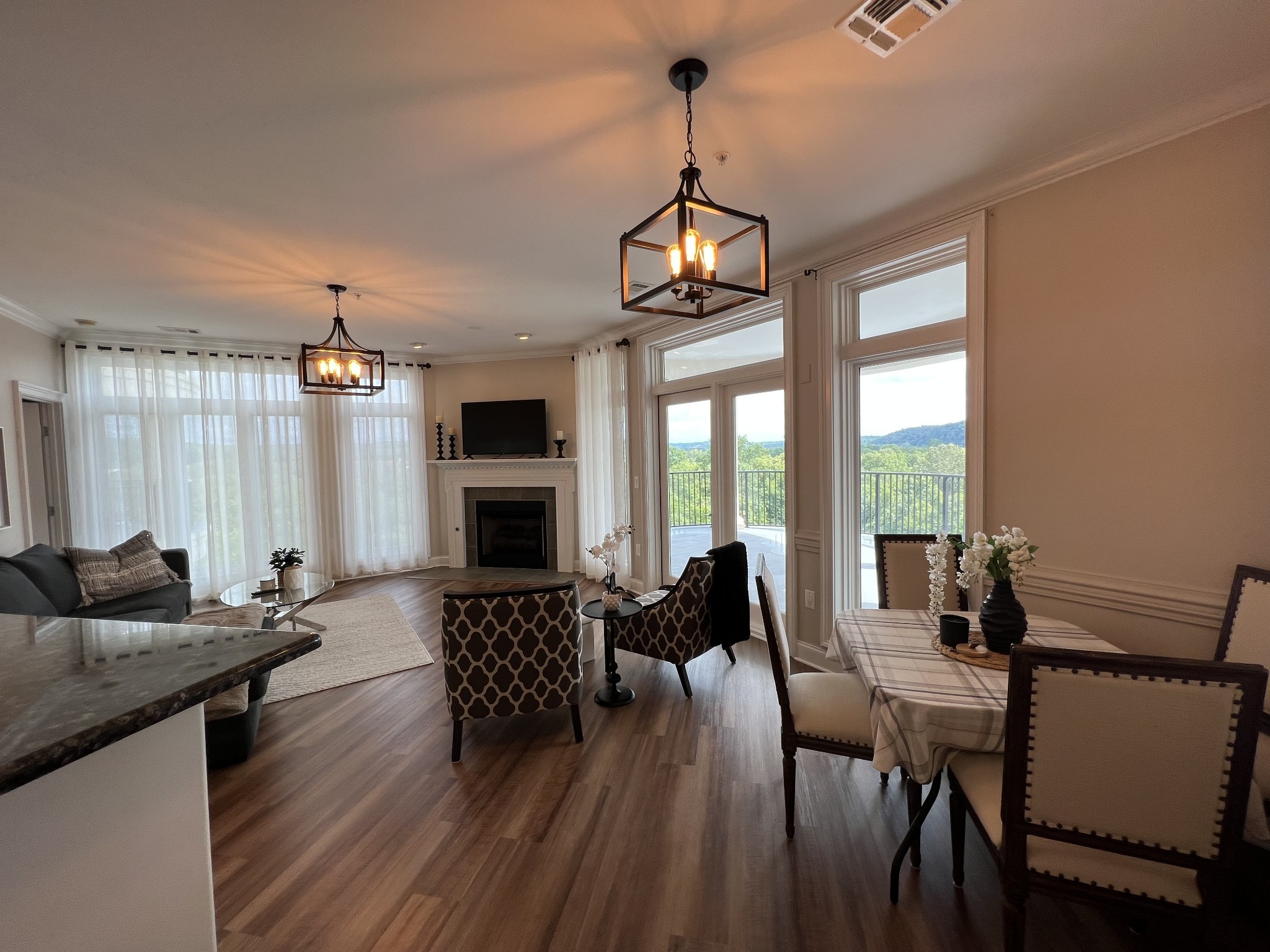 a view of a dining room with furniture window and wooden floor