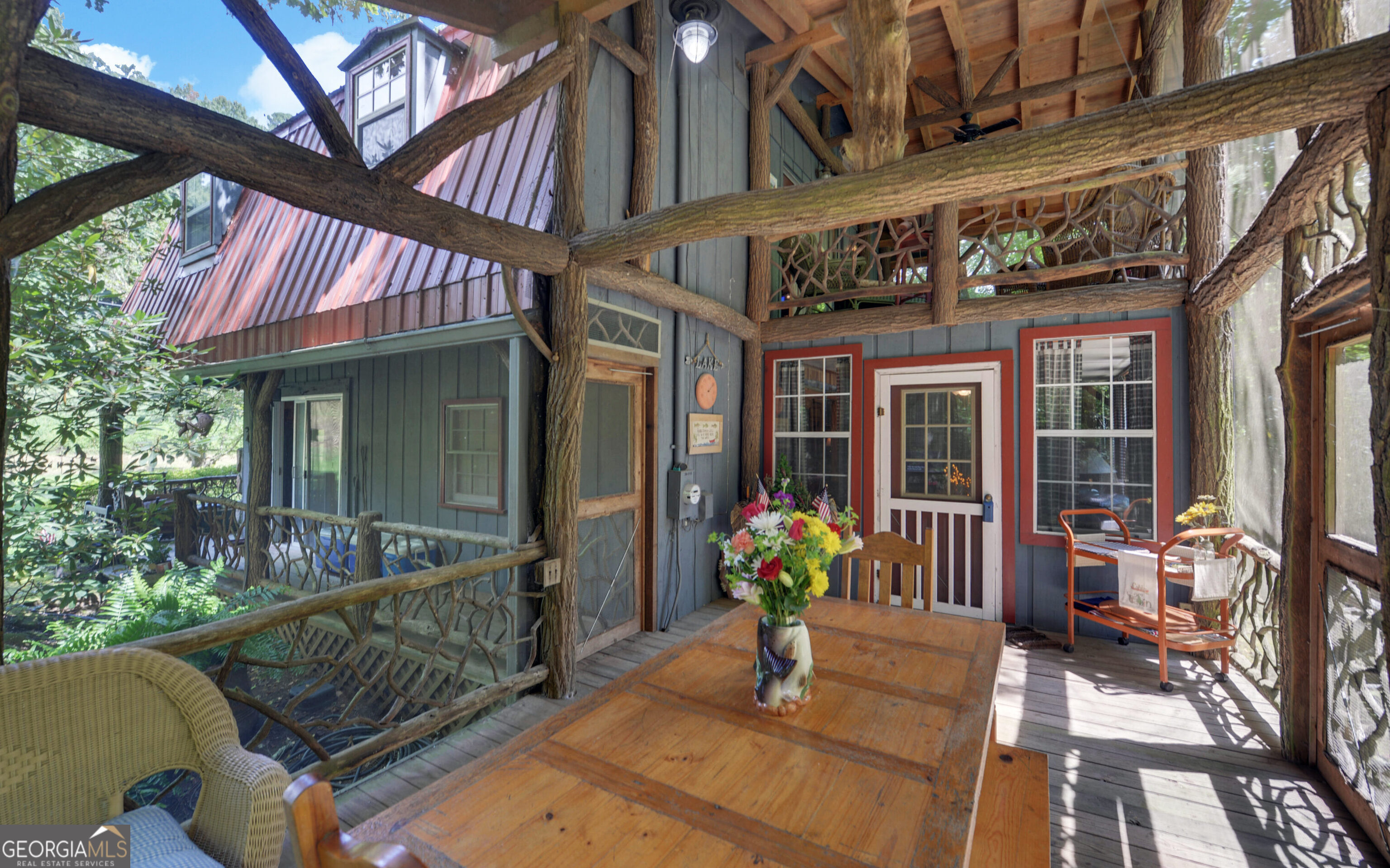 a view of a house with outdoor seating area