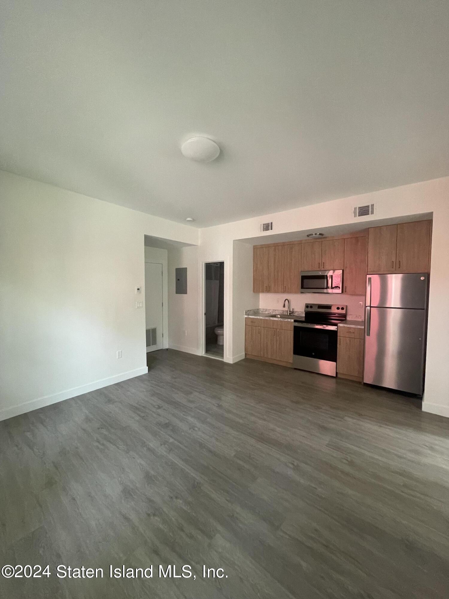 a view of a kitchen with a sink