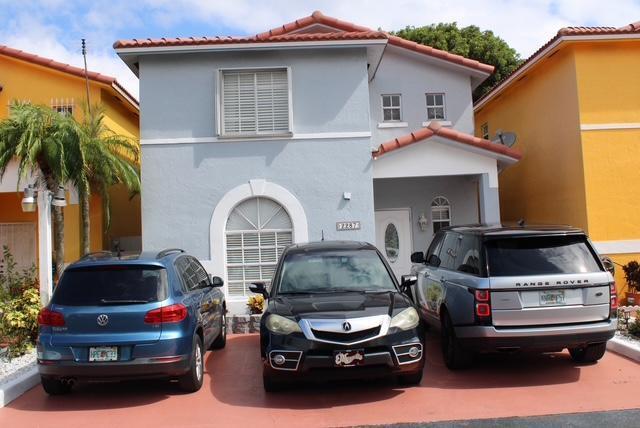 a car parked in front of a house