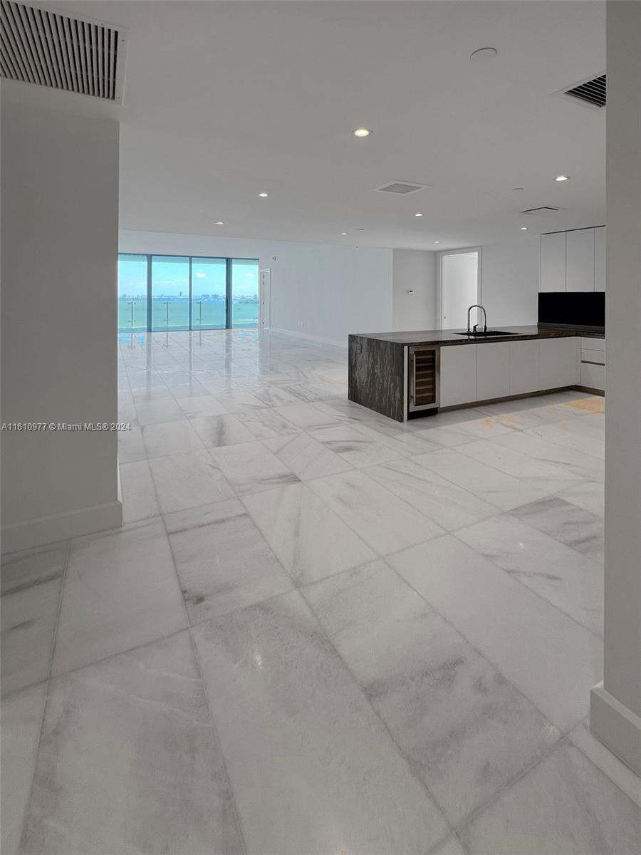 a view of a kitchen with a sink