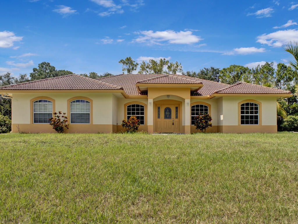 front view of a house with a yard