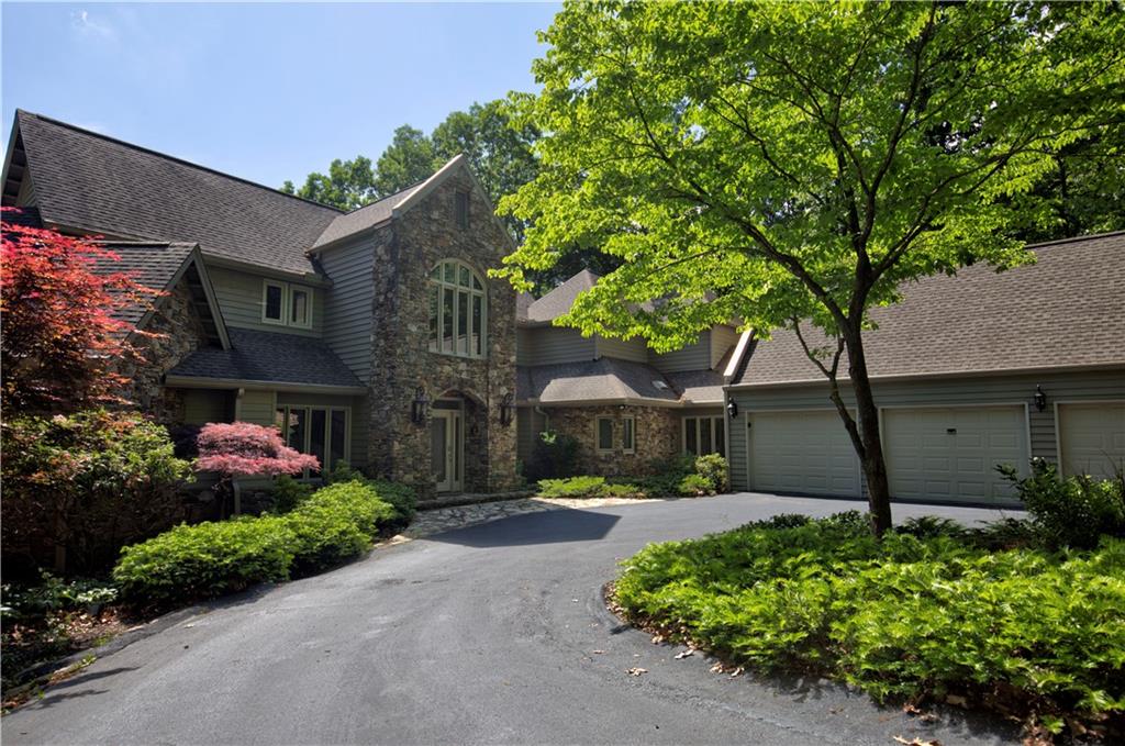 front view of a house with a tree