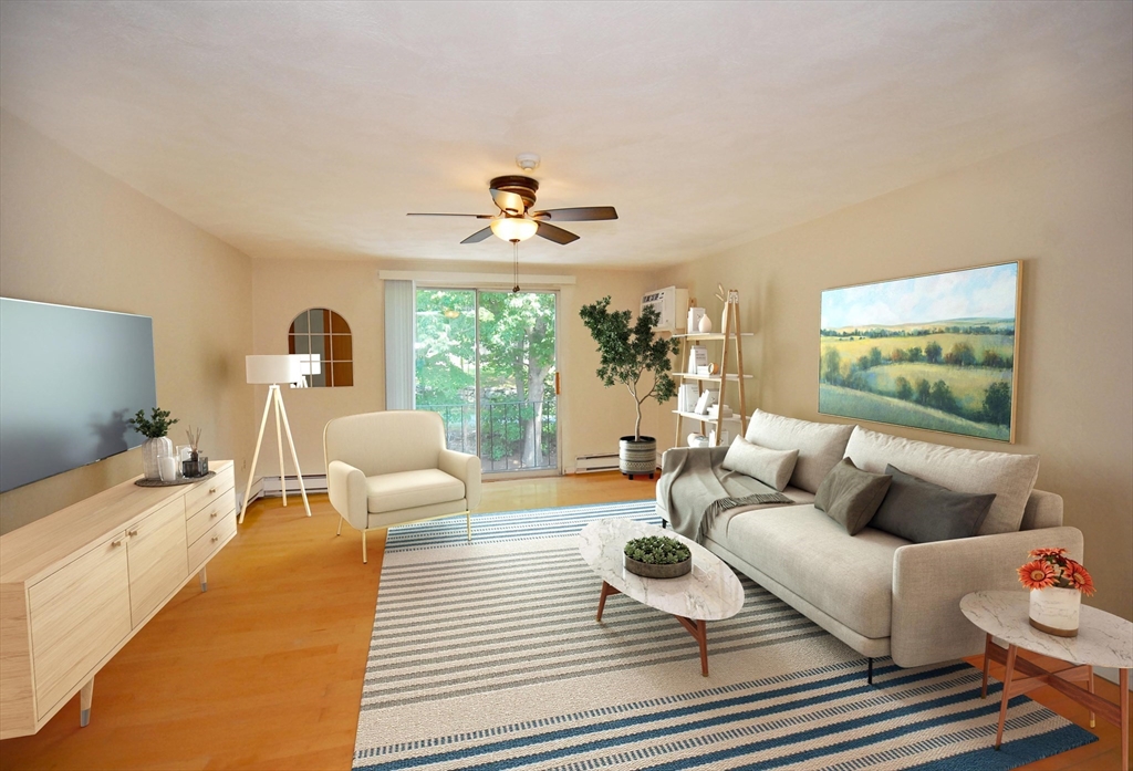 a living room with furniture and a large window