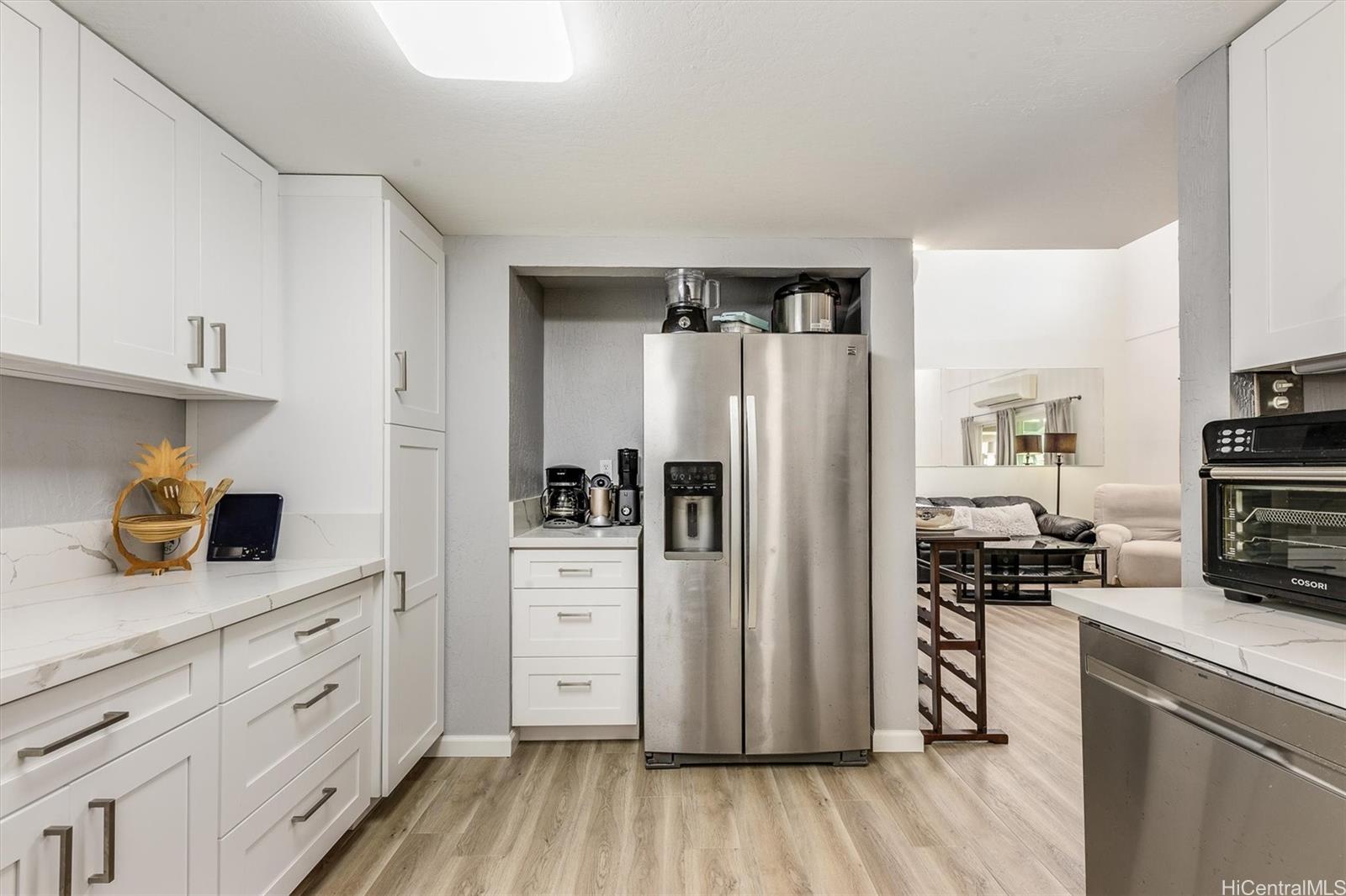 a kitchen with stainless steel appliances a refrigerator stove and sink