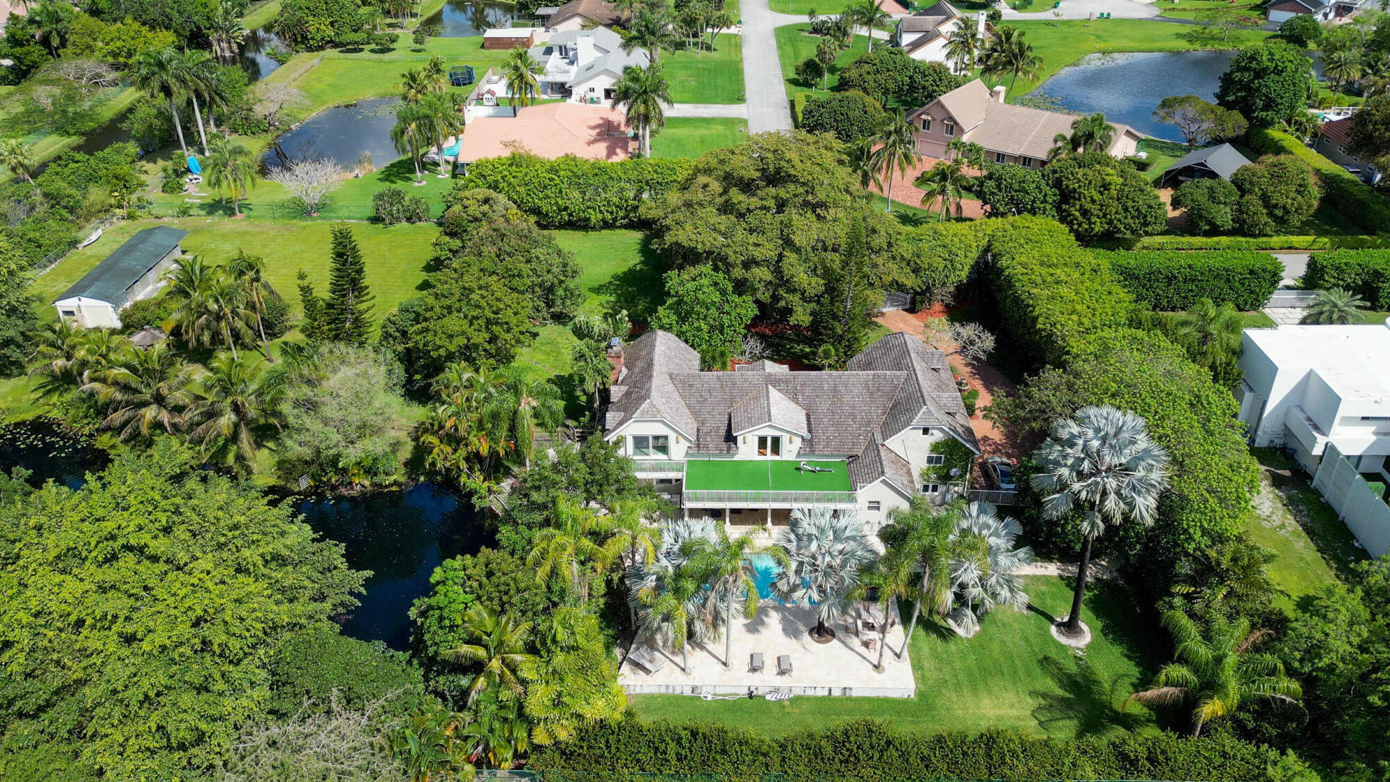 an aerial view of residential house with outdoor space and street view