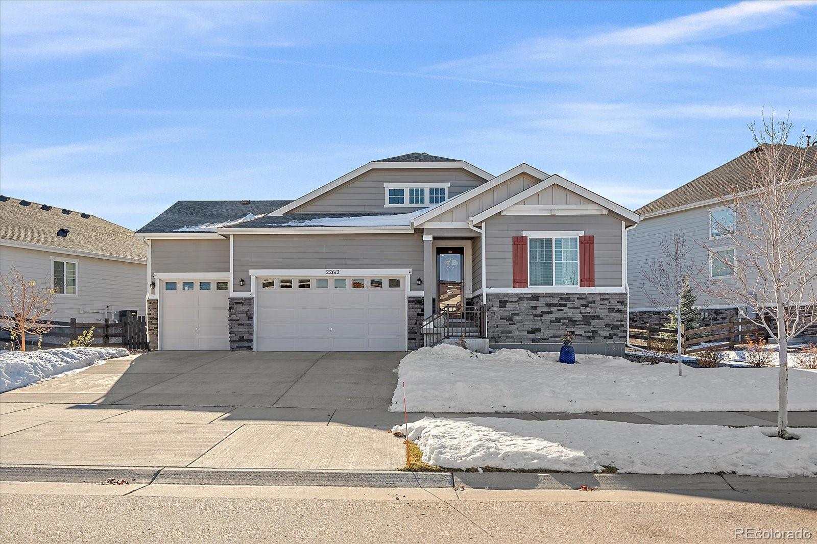 a front view of a house with garage