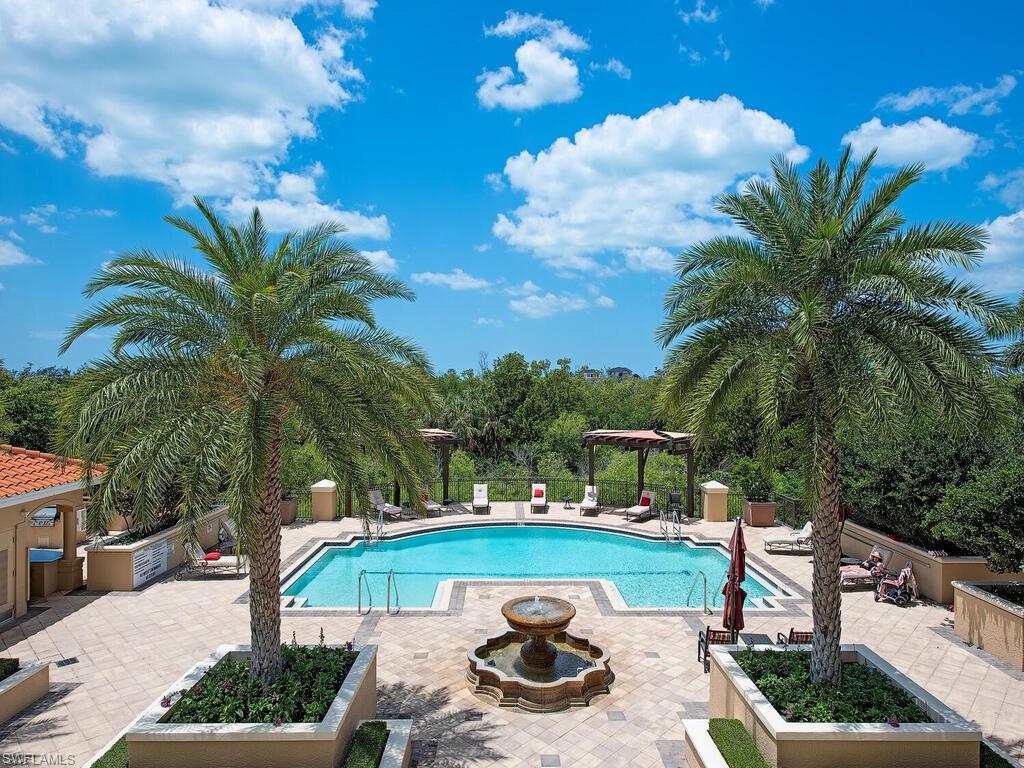 a view of a swimming pool with a patio