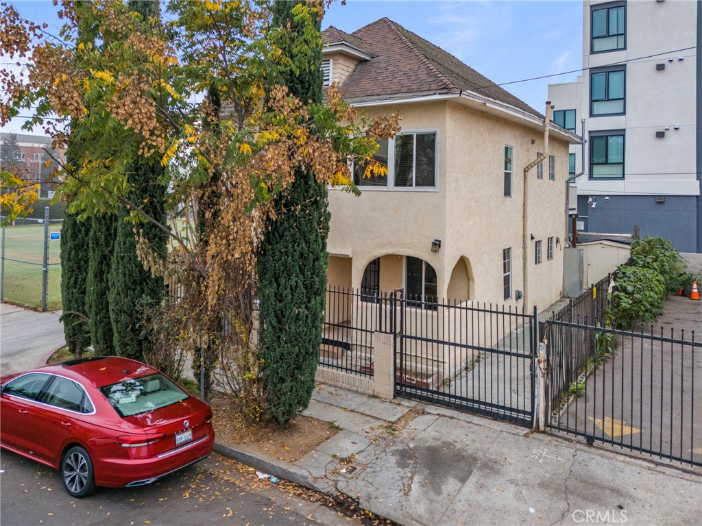 a view of a car is parked in front of a house