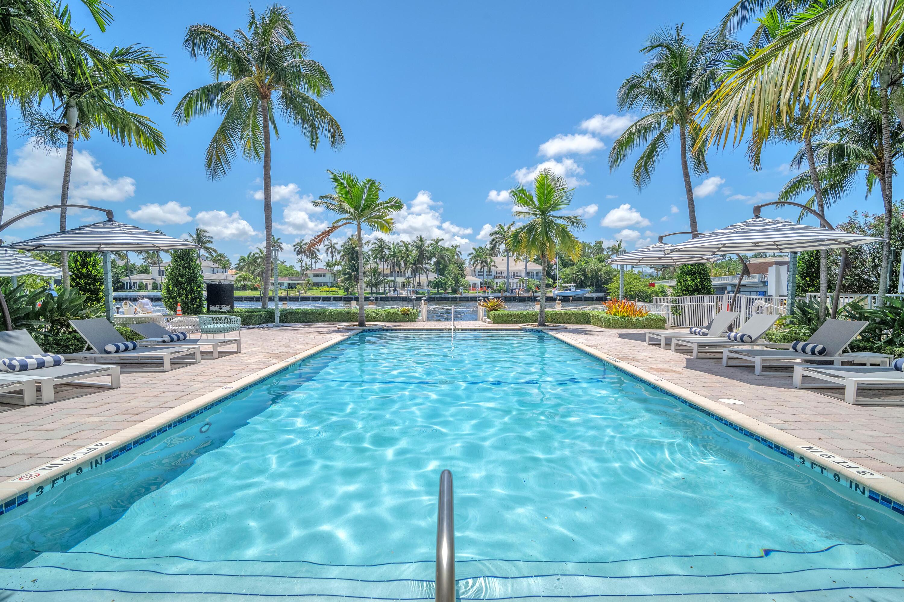 a view of a swimming pool with a patio