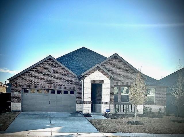 a front view of a house with a garage