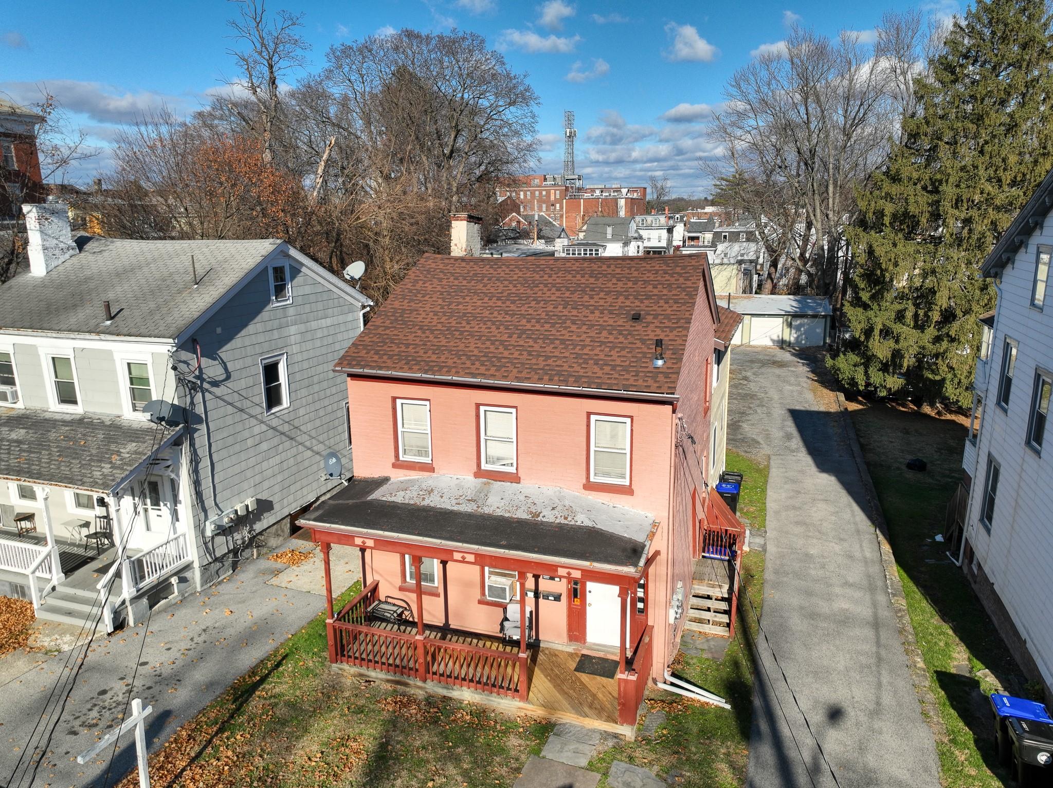 Back of house featuring covered porch