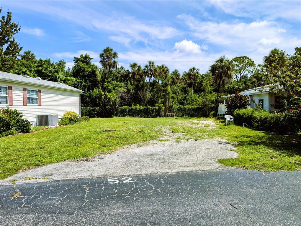 a view of a house with yard and a garden