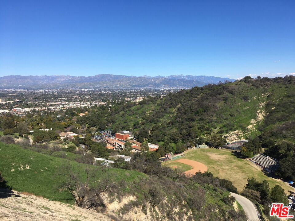 a view of a city with mountains in the background