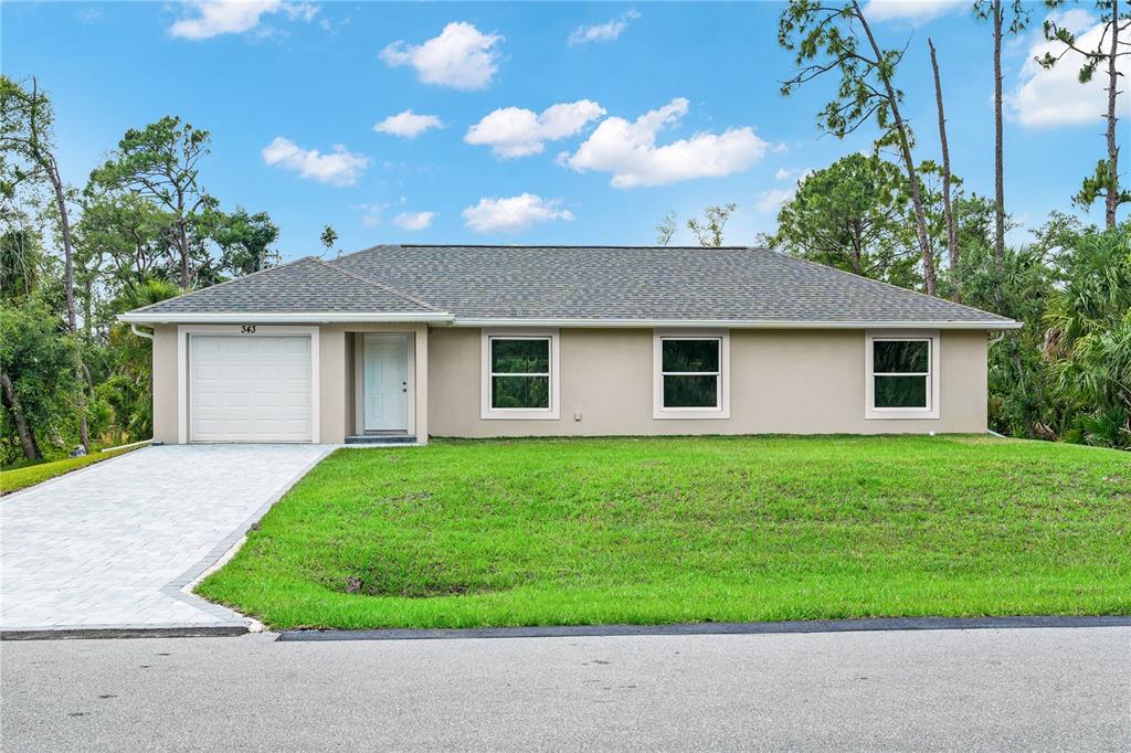 front view of a house and a yard