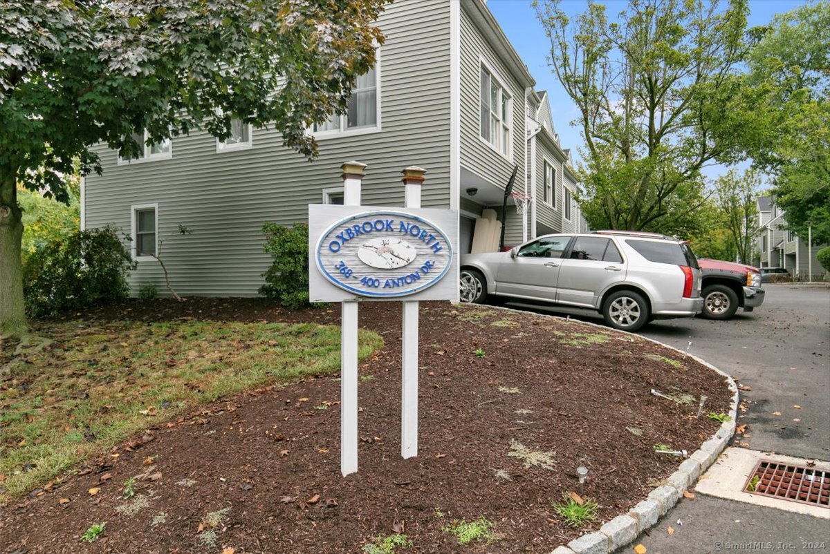 a front view of a house with parking space