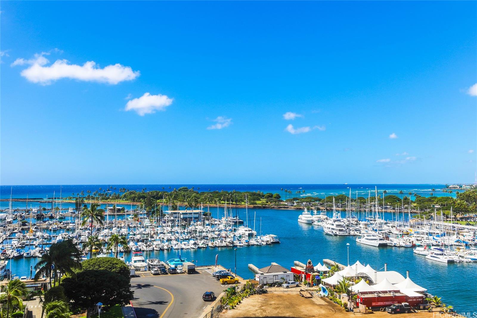 a view of a ocean with boats and a ocean view