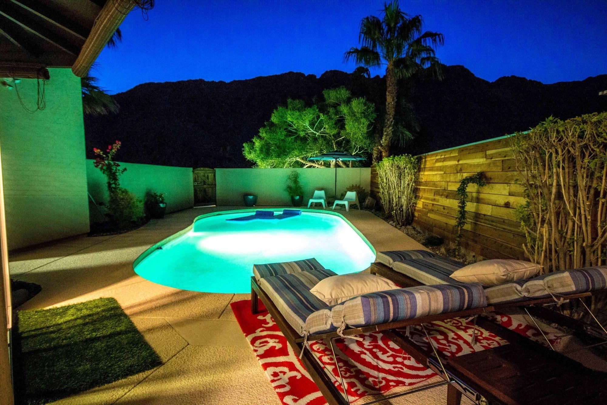 a view of an outdoor sitting area with swimming pool