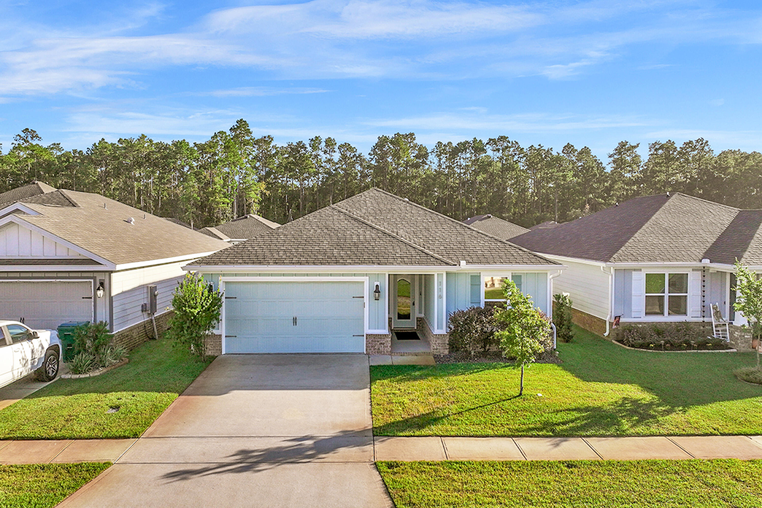 front view of a house with a yard