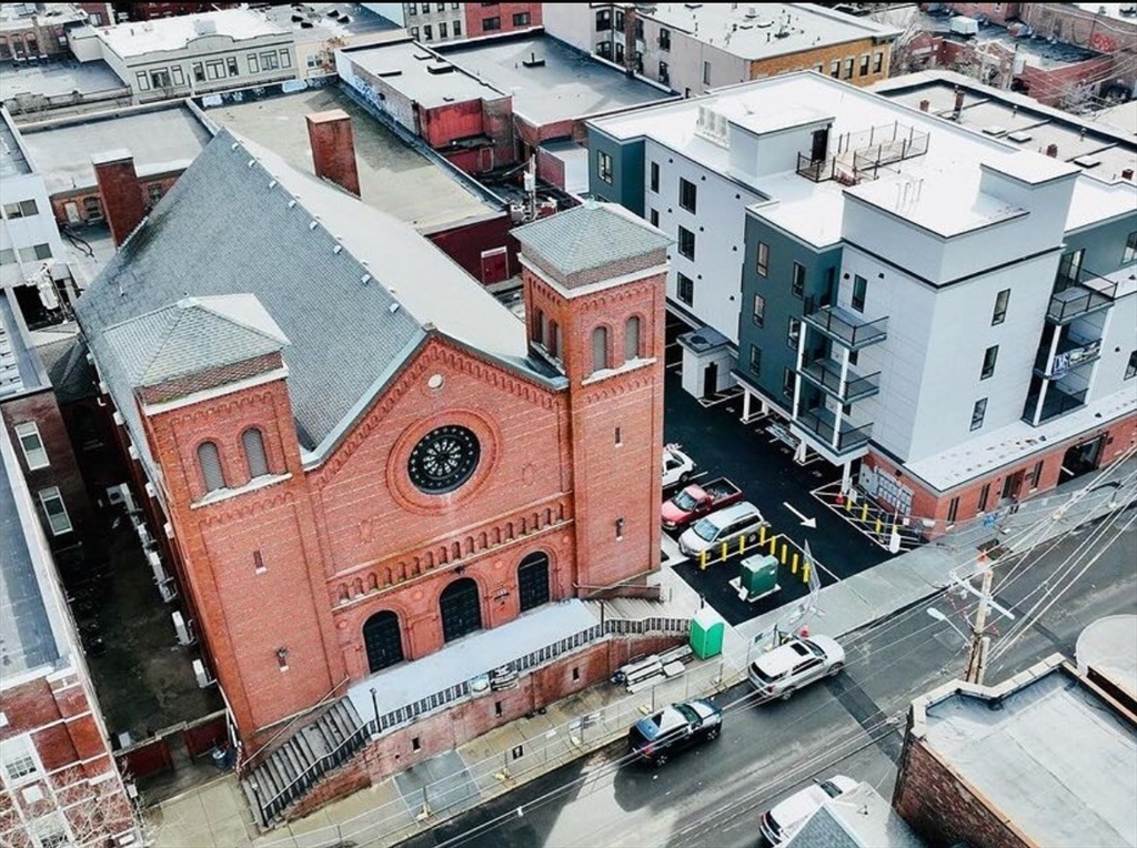 an aerial view of a house with a garage